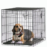 Savic Dog Cottage Crate 91cm Black with a beagle lying inside on the plastic base tray