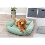 Poodle lying in the Trixie Alena square dog bed in sage