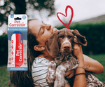 Company of Animals Pet Corrector spray in its pack, with a woman hugging her dog